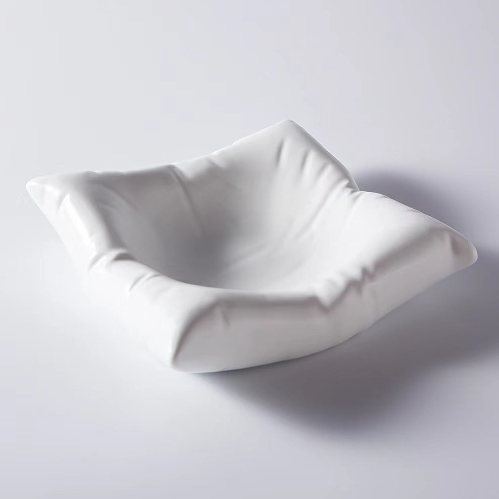 Cushion shaped plate